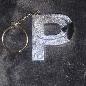 P Silver and black resin keychain